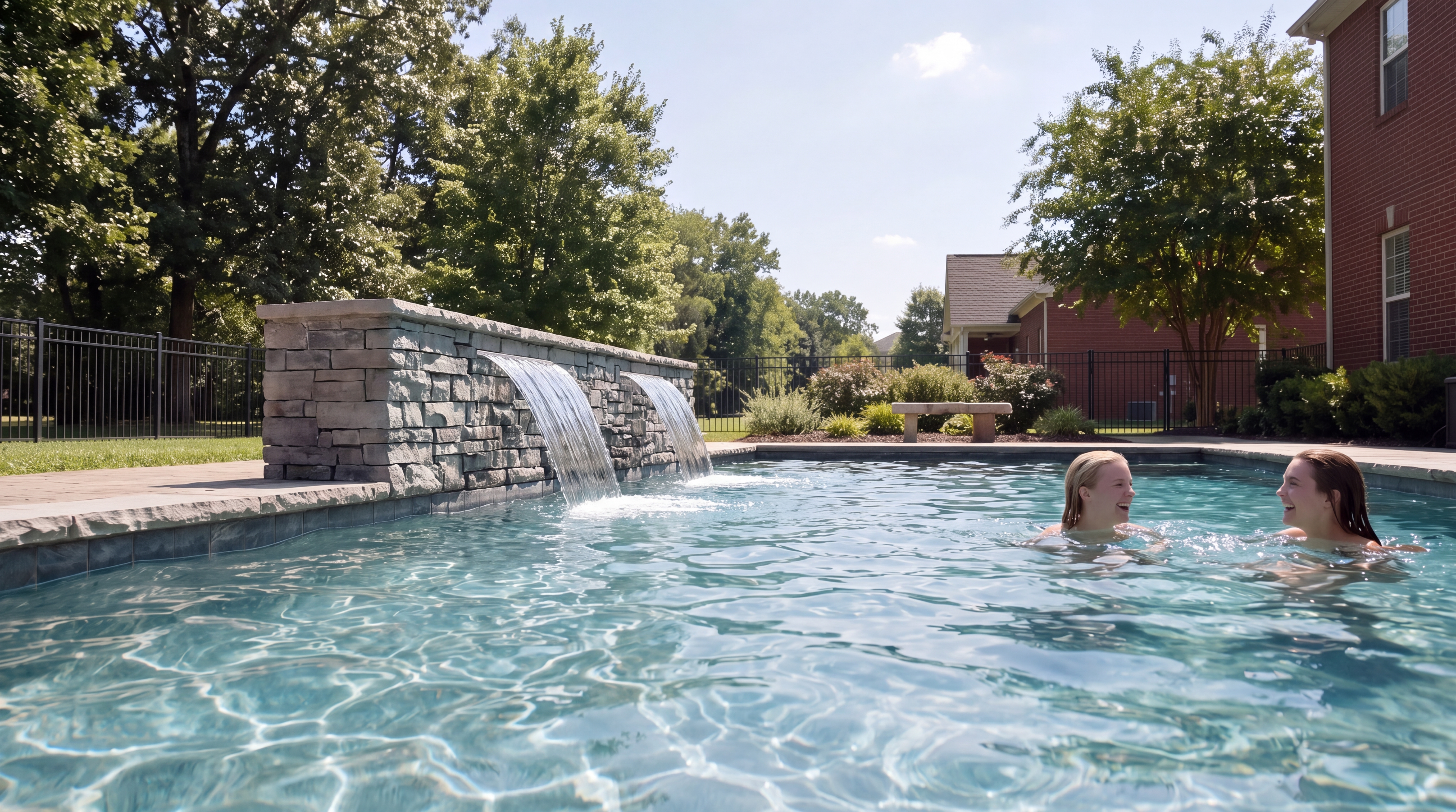 Gunite pool with stacked-stone waterfall wall built by Backyard Resort Pools in Murfreesboro, TN